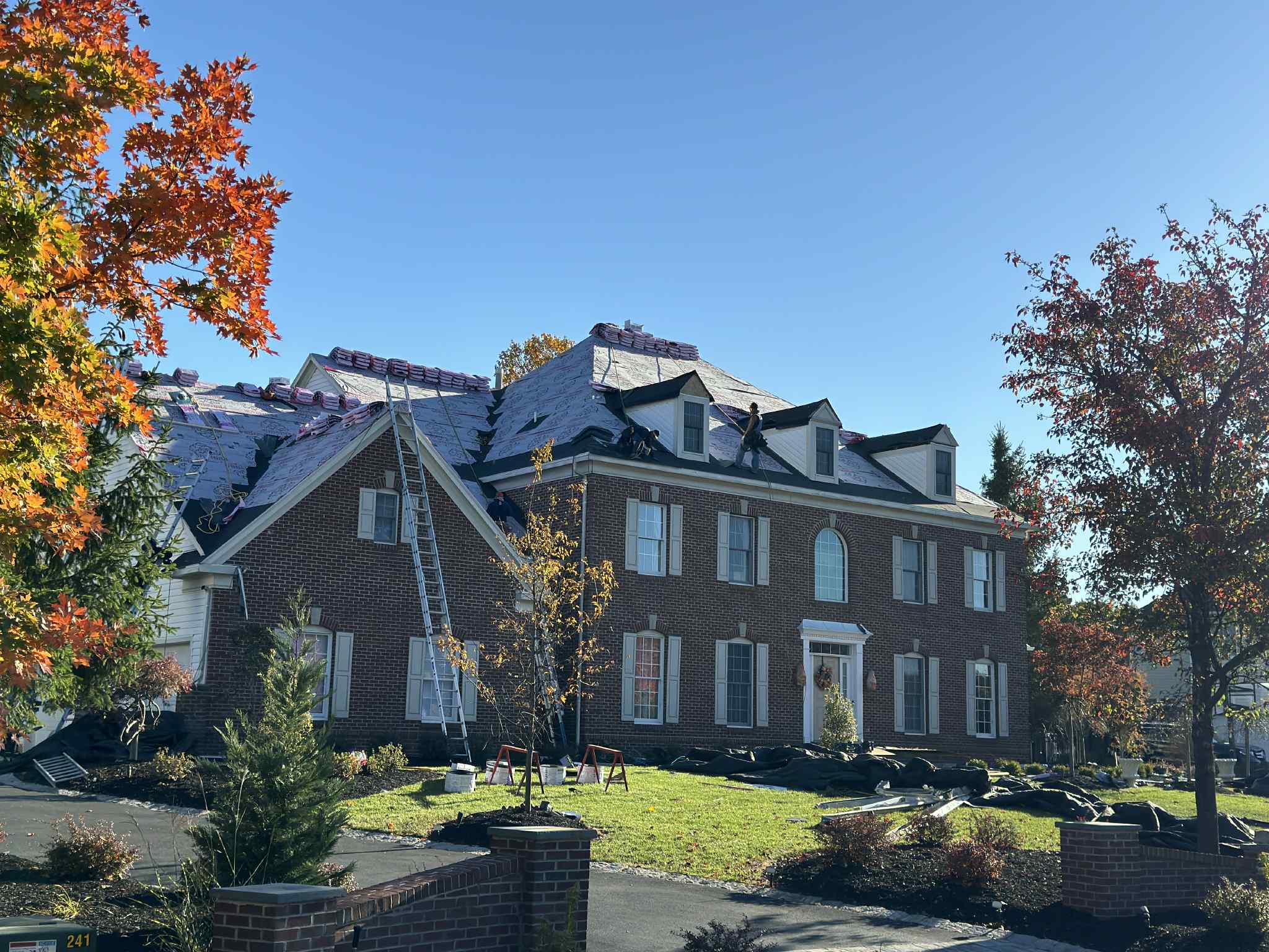 Professional Cephalo Roofing team installing premium asphalt shingle roof on New Jersey home with safety equipment